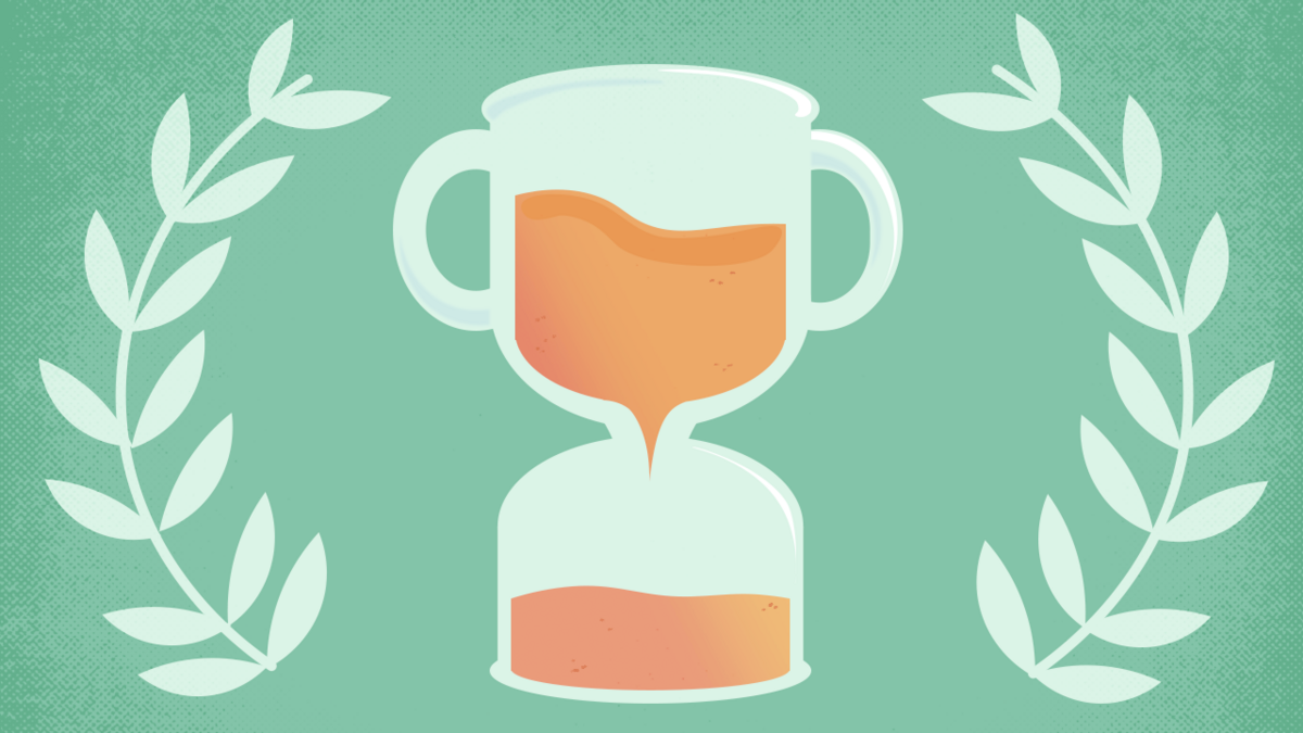 trophy that is an hour glass surrounded by laurel wreath